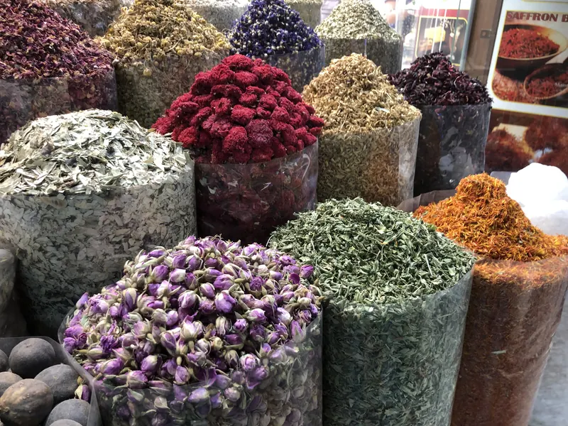 Dried roses, herbs and spices piled high in the Deira Spice Souk